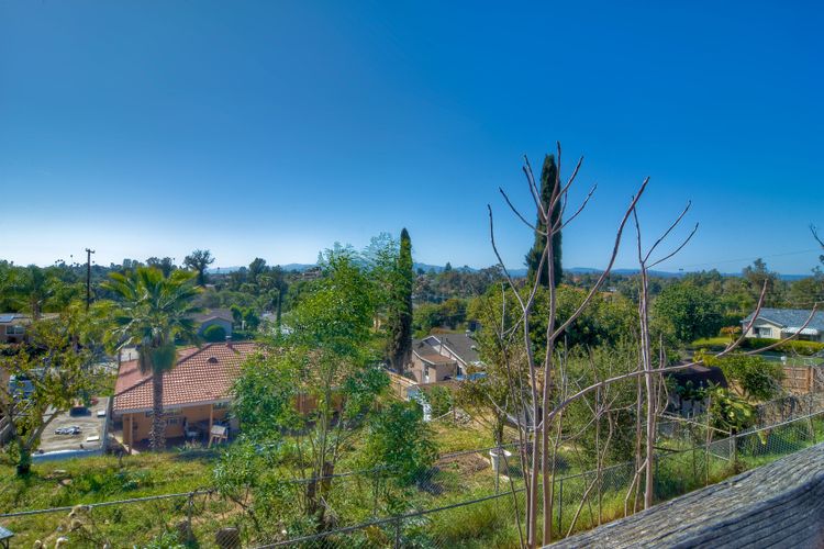Backyard view overlooking neighborhood